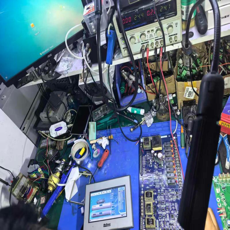 Technician is conducting repair and power-on commissioning of inverter drive board for refrigeration compressor